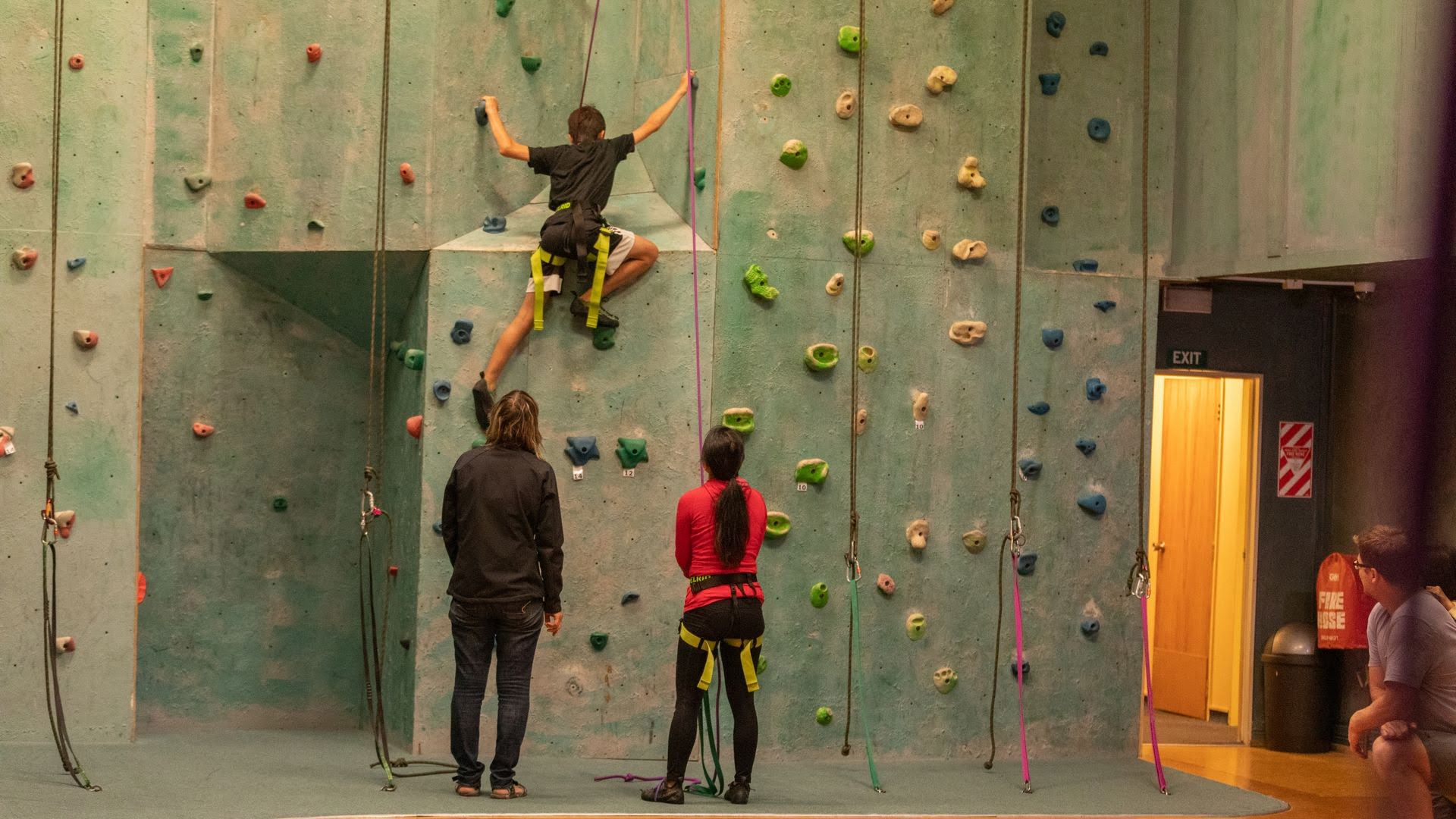 Family climbing the climbing wall in National Park Village - Visit Ruapehu.jpg